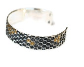 Silver honeycomb bracelet with gold honey details. Sterling silver bracelet cuff.