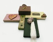 Reclaimed Wood, One of a kind Mixed Media, Wall Art, Ceramic Heart, Mini Houses, Welcome, Sea Shell, Found Objects. Black, Yellow, Brown.
