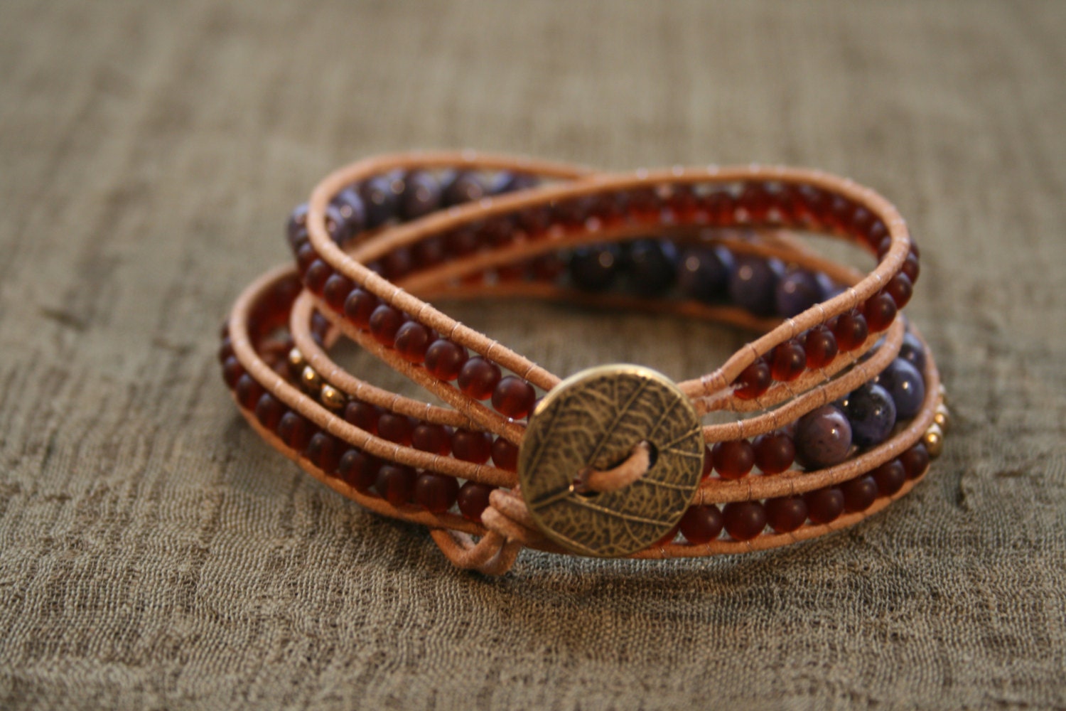 Purple Agate triple wrap leather beaded bracelet.  Semiprecious stones, garnet  Czech glass beads, natural leather, brass leaf button