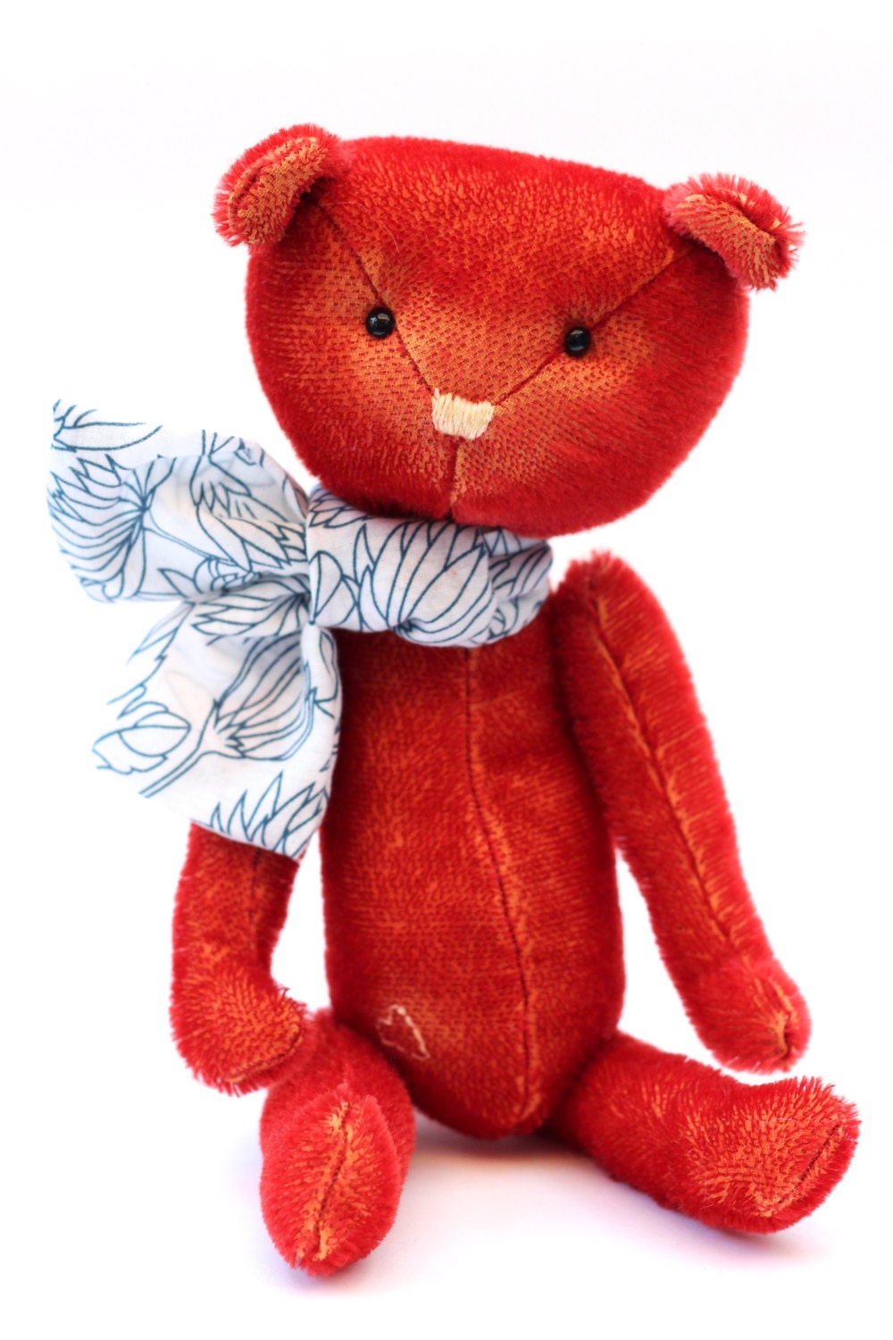 Rosie the red teddy bear with cute neck scarf