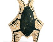 catnip cockroach drawn on gold tan spotted fabric
