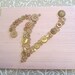 Baby Nursery Button Letter Monogram on Silk -- Taupe Tan Buttons on Light Pink Silk -- Ready-to-Frame (frame not included)