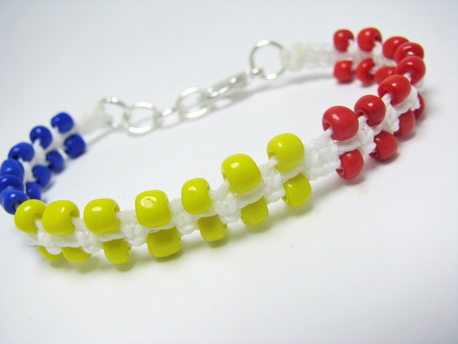 White Micro Macrame Bracelet with Small Red Yellow Blue Glass Beads lobster clasp
