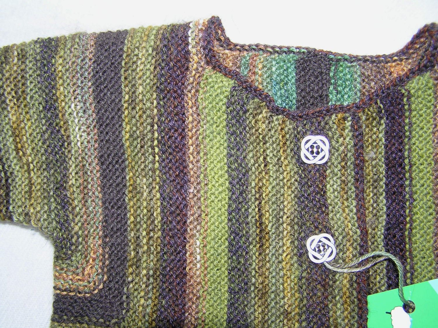 Handknitted green and brown striped baby jacket