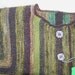 Handknitted green and brown striped baby jacket