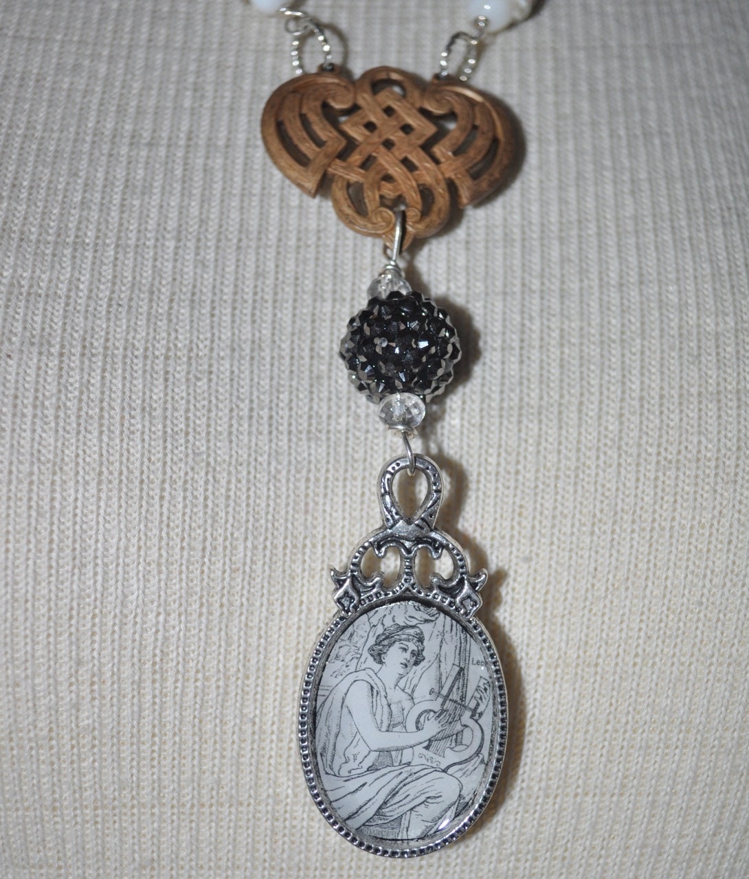 Repurposed vintage Greek goddess with harp silver and brass long necklace.