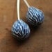 Carved pods in pale blue
