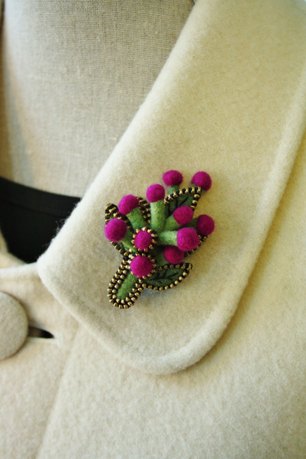 Felt and zipper  pod brooch