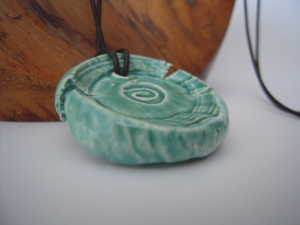 handmade ceramic rustic thick swirl pendant on leather cord