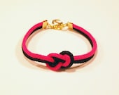 Matte neon fuschia pink and black infinity knot nautical rope bracelet with gold anchor charm