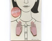 pair of hand-painted hand brooches