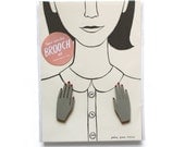 pair of hand-painted hand brooches