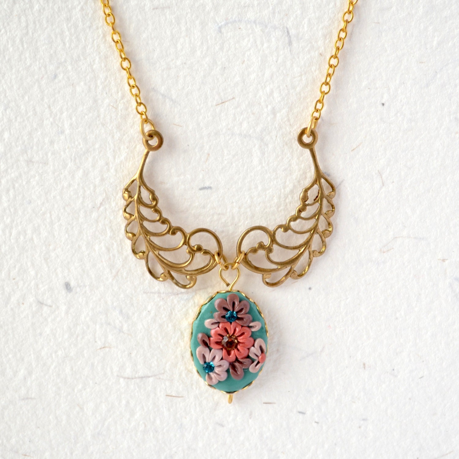 Gold angel wing necklace - floral