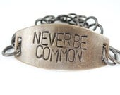 Never Be Common Hand stamped brass bracelet