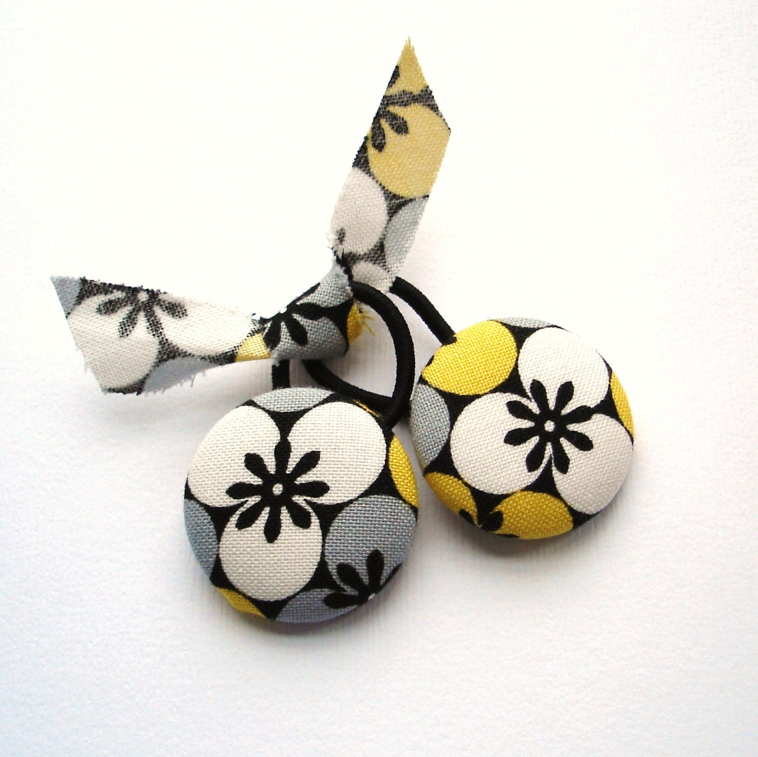 Hair Ties. White, Black, Yellow, and Gray.