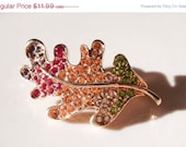Summer Sale Vintage Monet Gold Leaf with Red Yellow Green Rhinestones Brooch