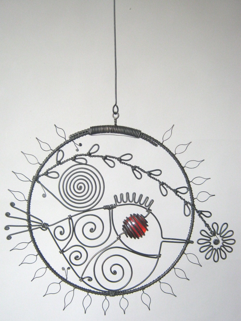 Metal Sculpture Wire Bird In A Round Leafy Frame