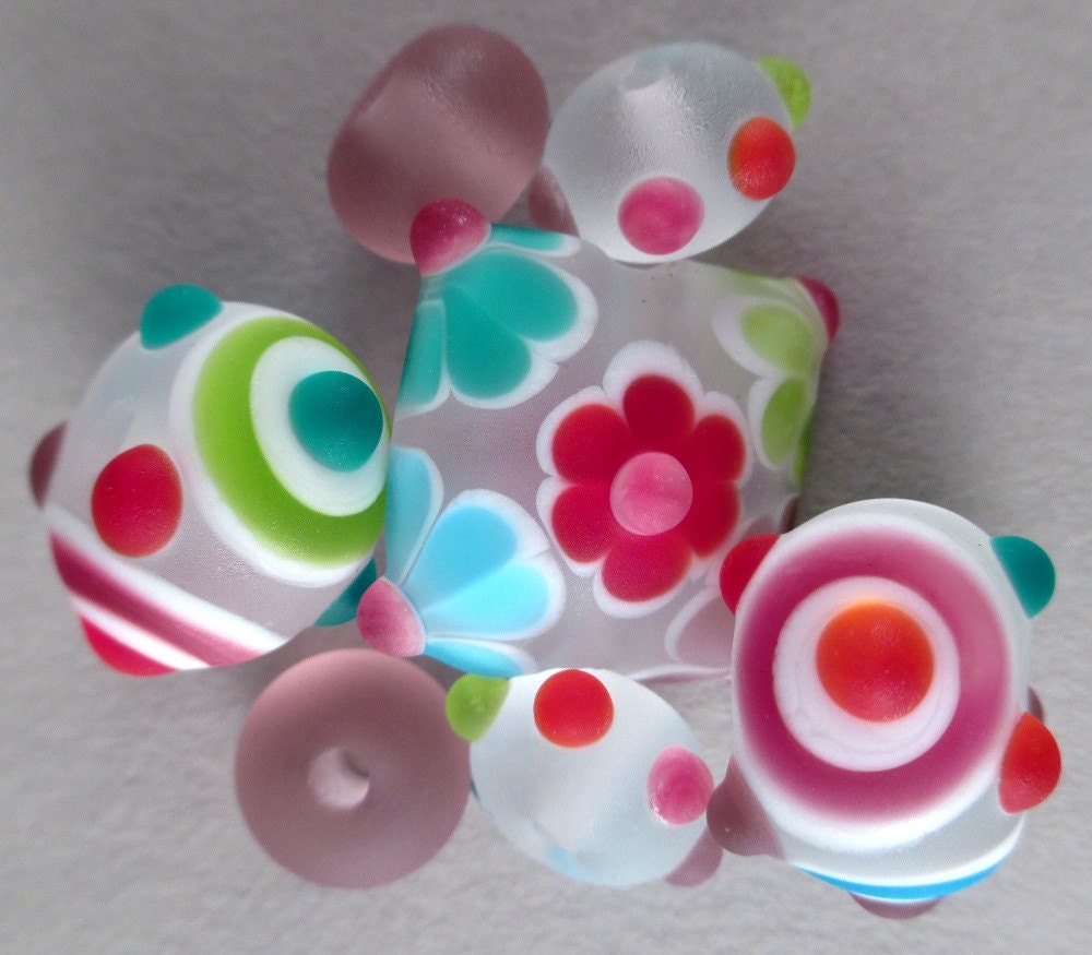 Handmade Lampwork Bead Set of 7 by Patti Cahill, sra -- Frosty Rainbow color scheme with pillow focal