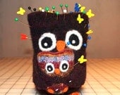 Large Mama Owl holding her little baby owl pin cushion weighted to stand toy for the stitcher in your life.
