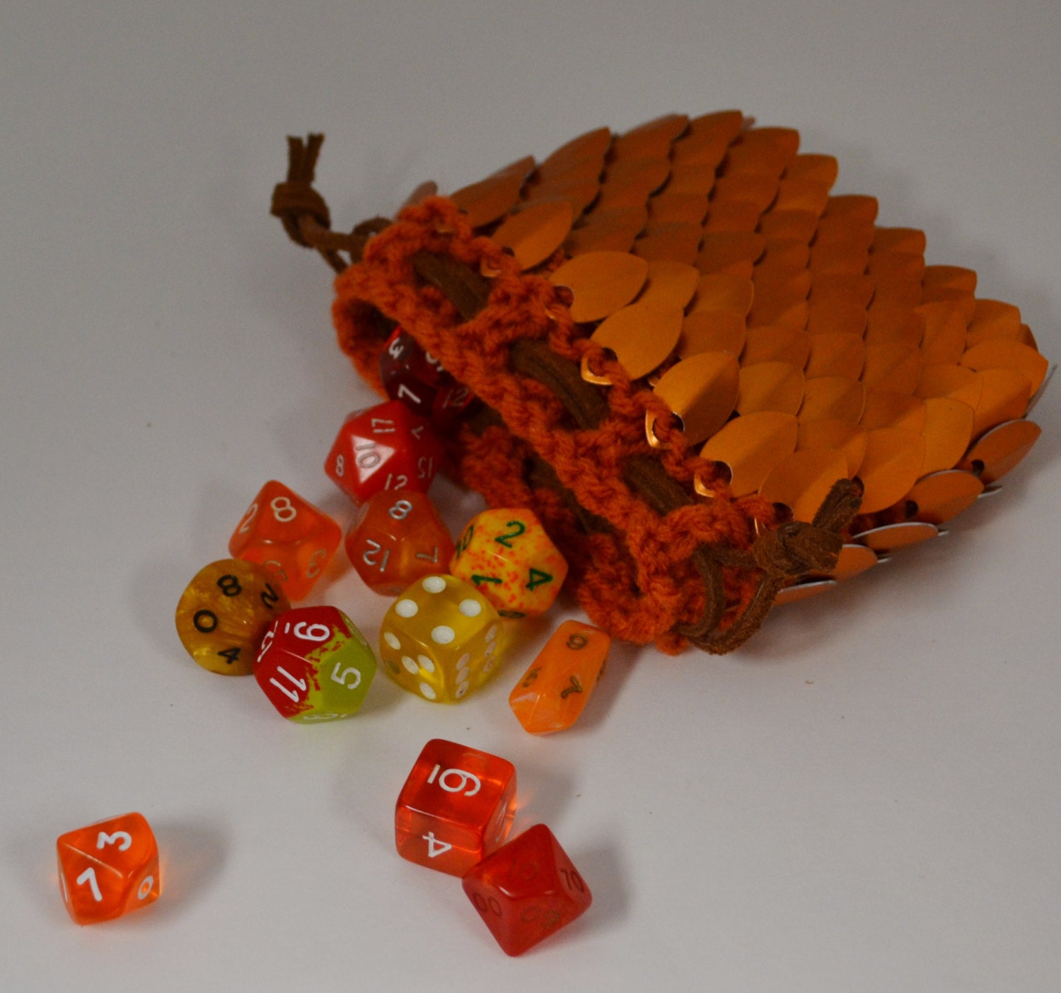 Scale Maille Dice Bag in knitted Dragonhide Armor Orange
