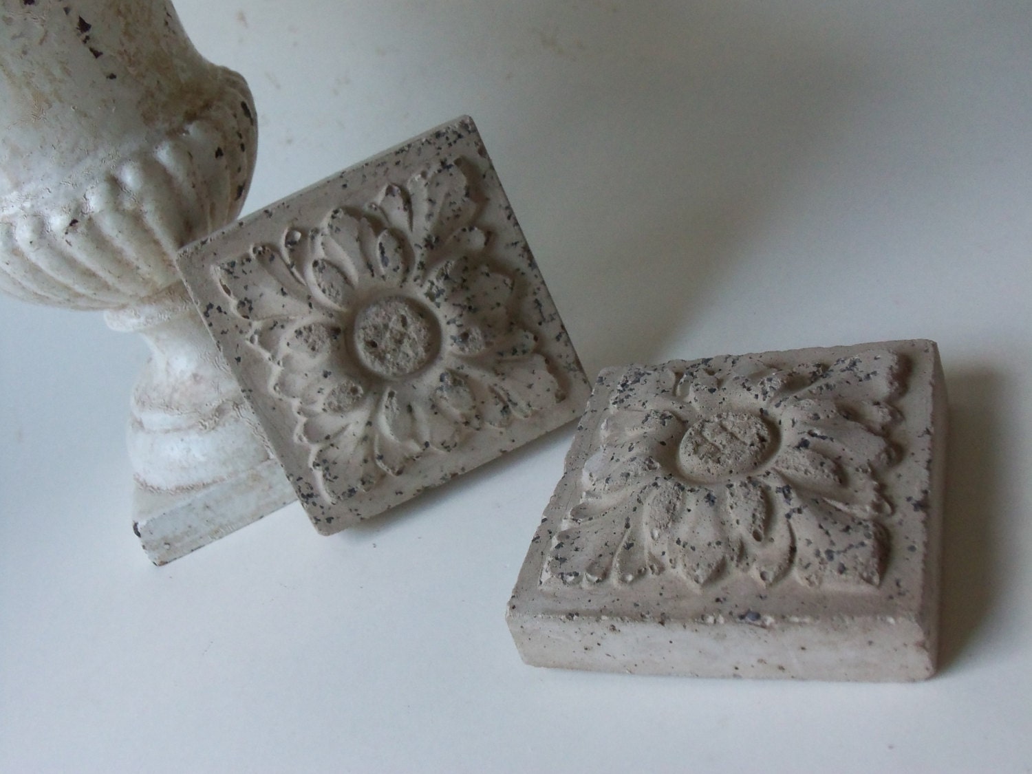 two cement leaf tiles