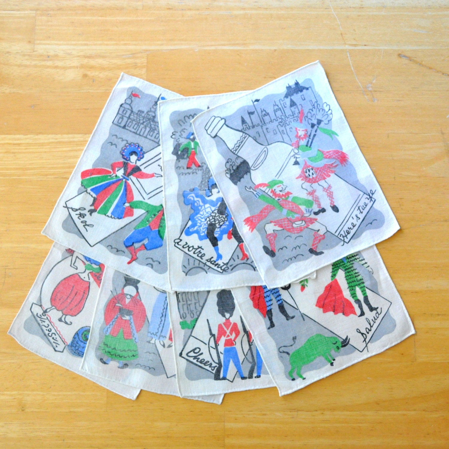 set of seven mid century international "cheers" cocktail napkins