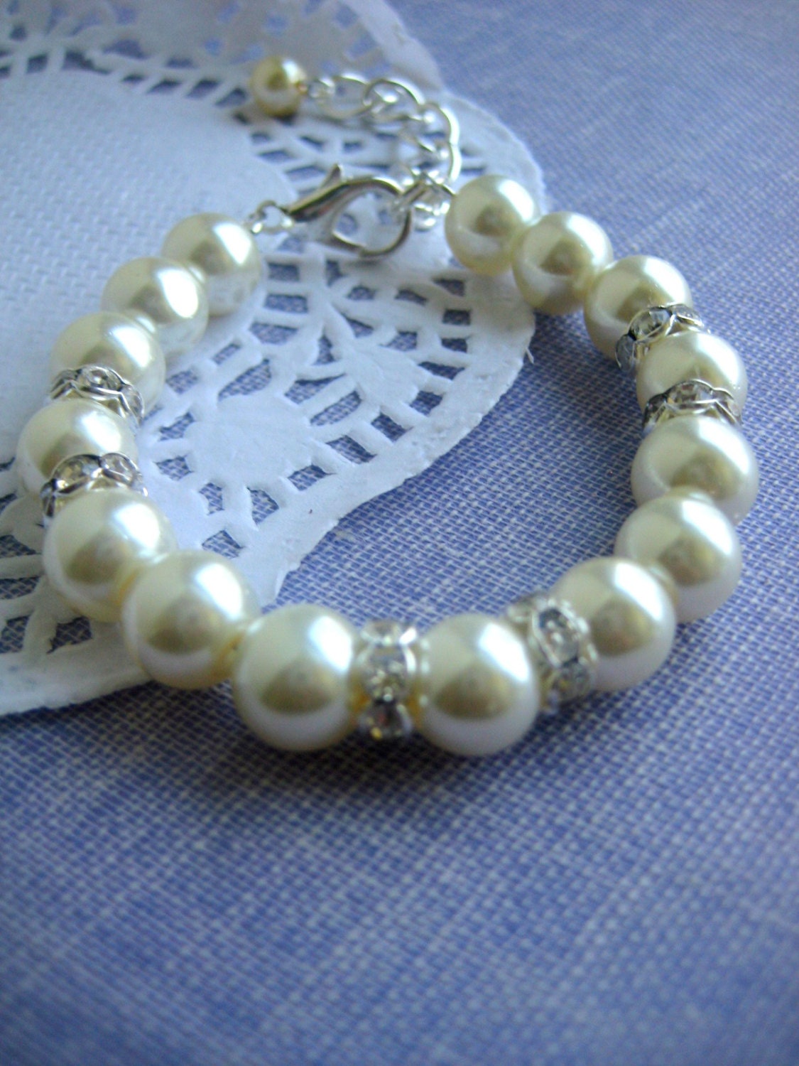 Child ivory glass pearl rhinestone bracelet. Extender, pearl drop.
