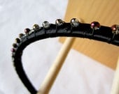 Jet black head band with midnight purple crystals. Beautiful comfortable and flexible hair band.  0192