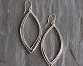Lightweight sterling silver earrings containing 3 wire leaf shapes, free to move and dangle from handmade silver earwire - "Laurel Earrings"