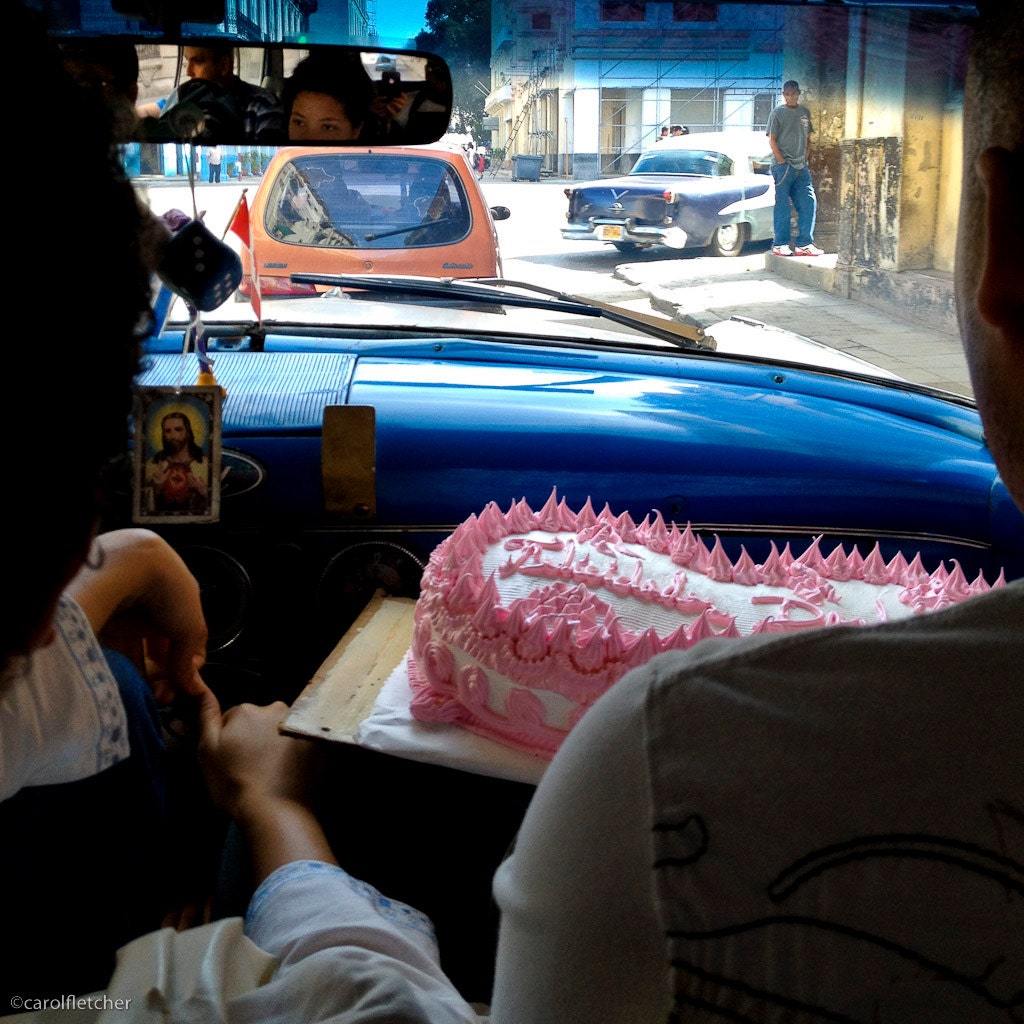 In a peso taxi with cake - Havana Cuba - 5x5 - felicidades - pink icing - old car - cuban art - street