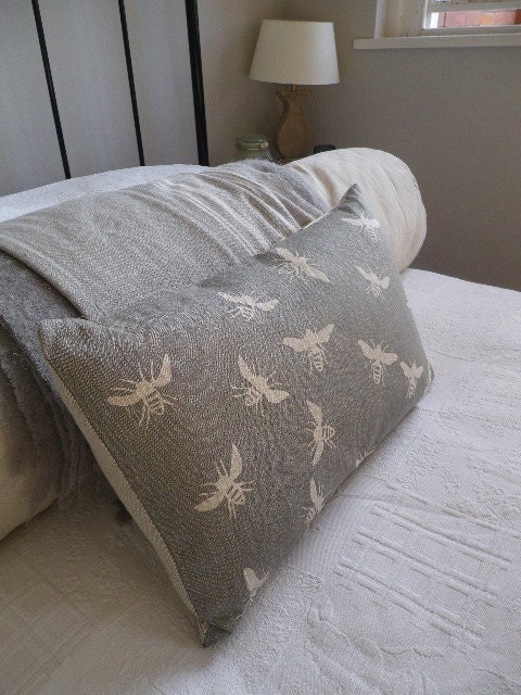hand printed muted grey bee cushion cover
