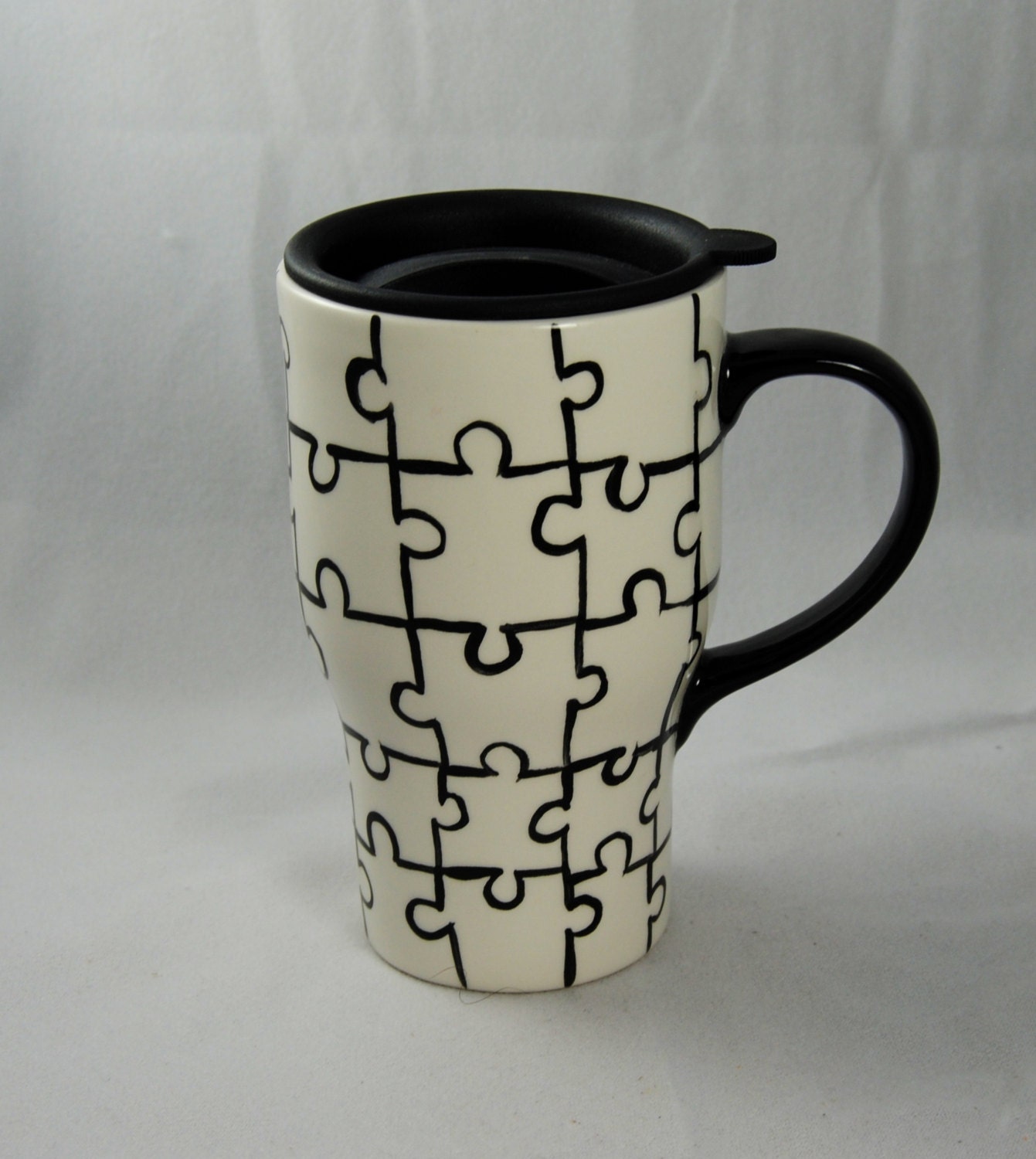 Puzzle Patterned Travel Mug with a lid