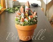 Fairy Village of Potterville  -  Miniature Medieval Walled City of Houses and Towers - Terracotta Pot with Flowers, Mushrooms and Pine Trees