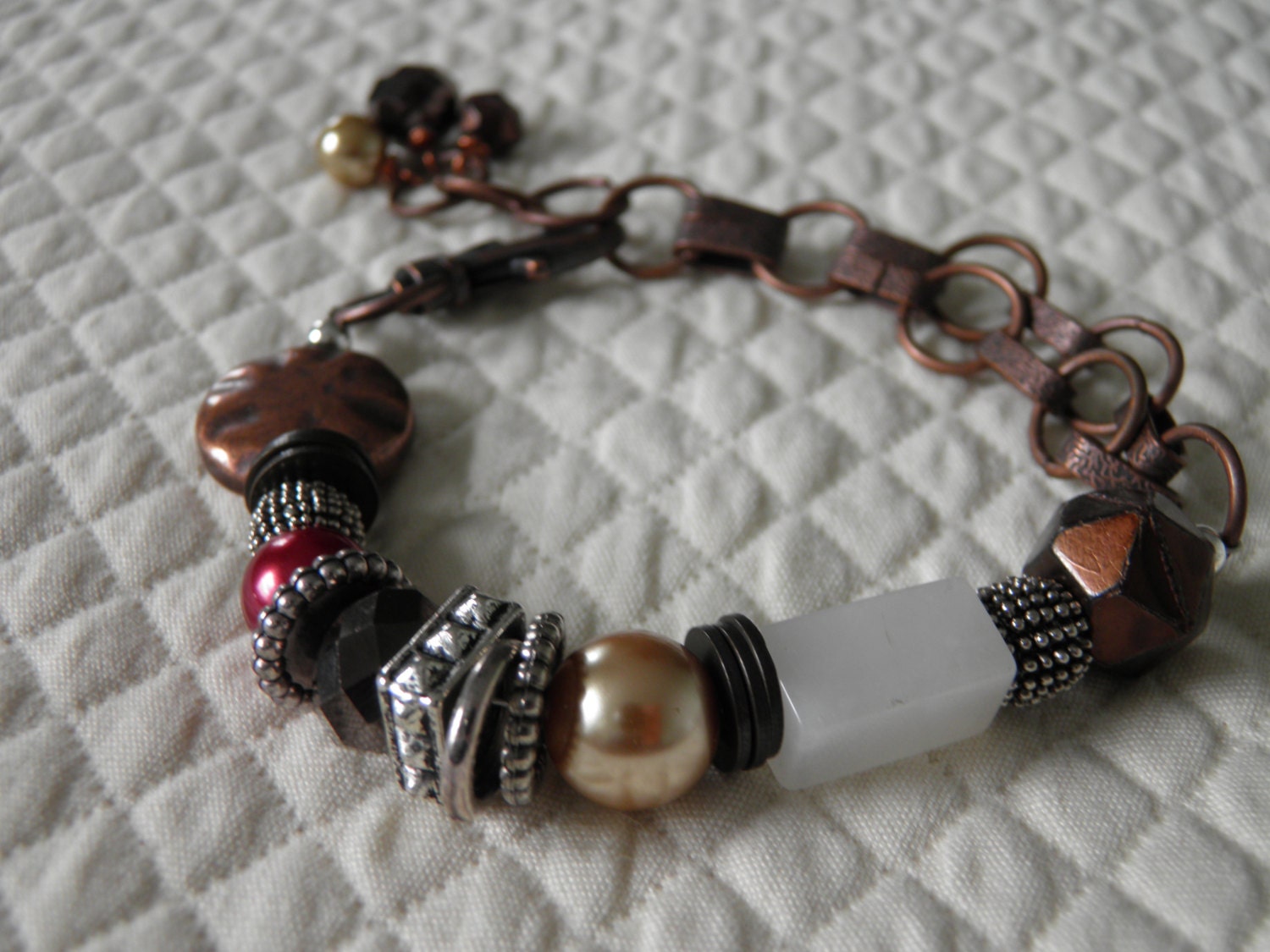 Copper beaded chain bracelet with a mix of pearl and other elements...