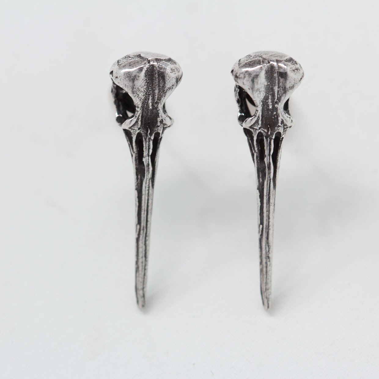 Hummingbird skull studs post earrings in sterling silver made in NYC
