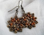 Dark Bronze and Orange Picasso Bead Earrings - Rustic Snowflake