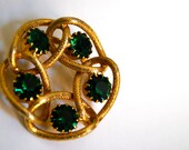 Gold Brooch With Green Stones