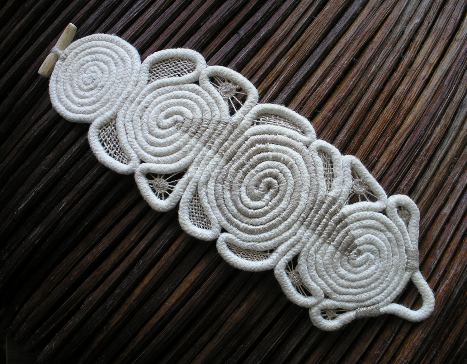 Embroidered nature  textile bracelet .