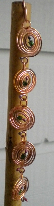 Coils and Coils Copper Bracelet with Green Glass Beads