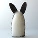 Three small felt rabbits - gray, cream and brown