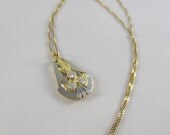 Deco Diamond Pendant. French, Circa 1920s in White and Yellow Gold.