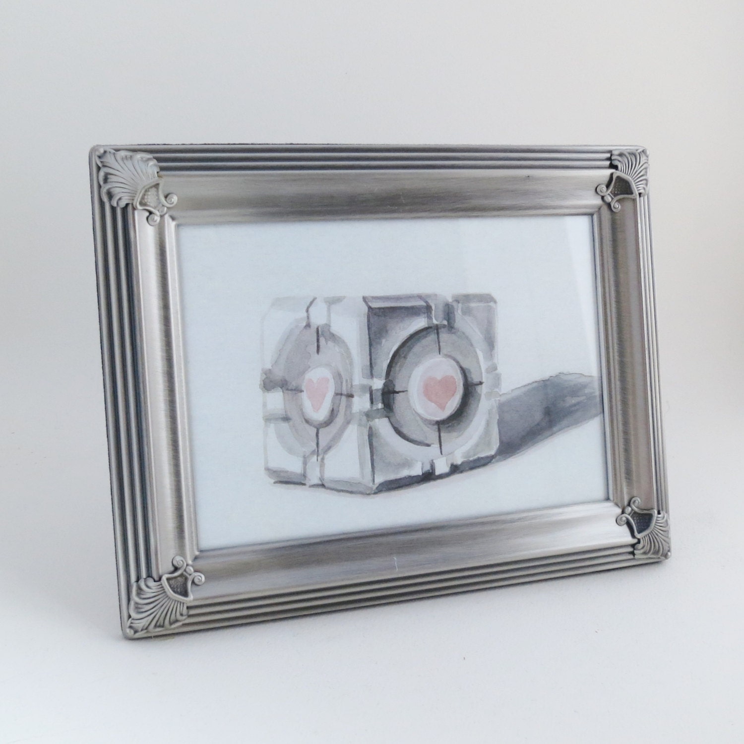 Framed Print, Companion Cube in silver frame