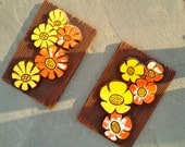 Flower power ceramic wall hangings in yellow and orange 1970s vintage