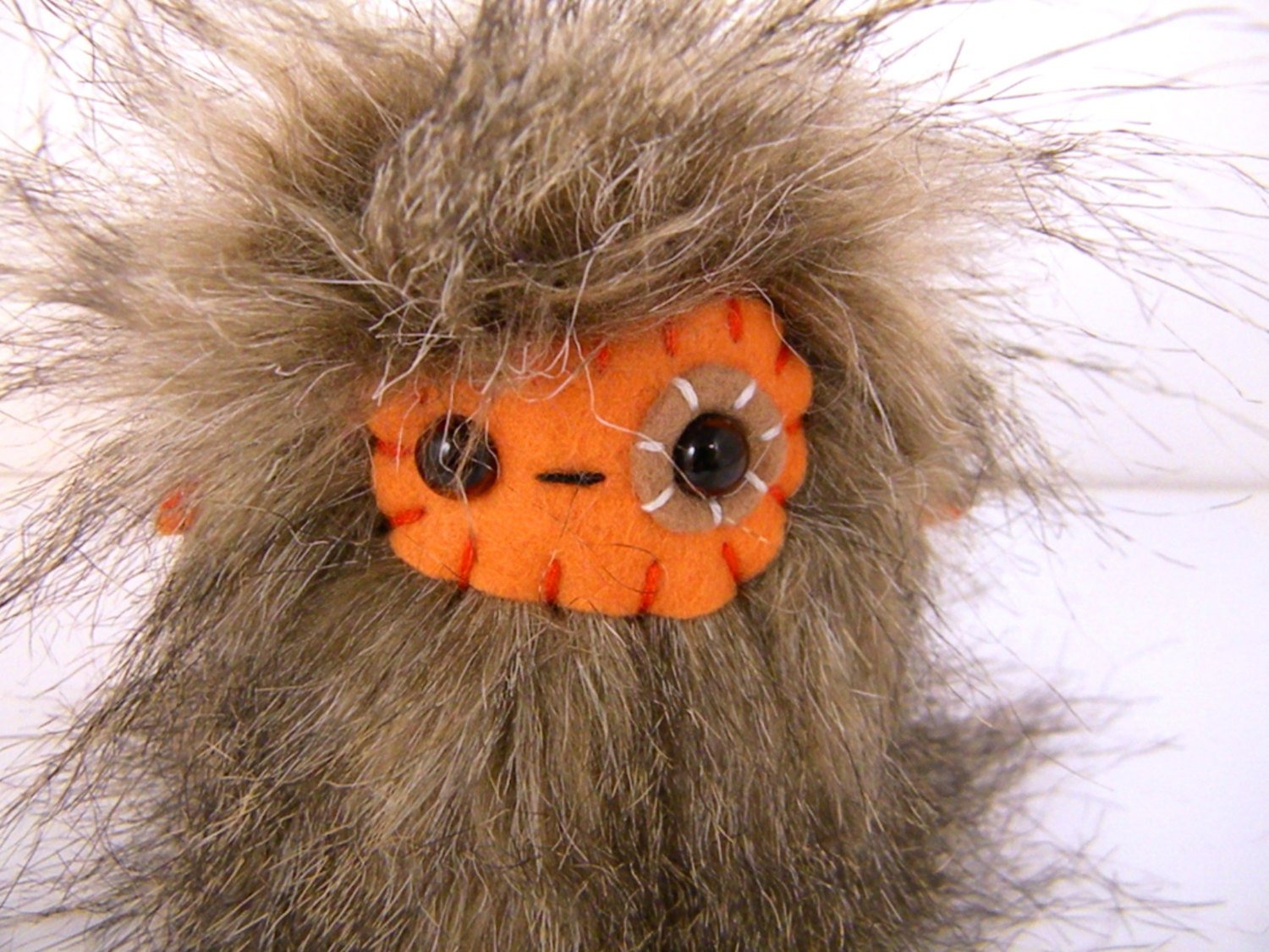 Paulie the plush monster miniature brown and orange animal Little Uggle