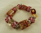 Lampwork Bracelet Red Gold Swirls Crystals Stretch