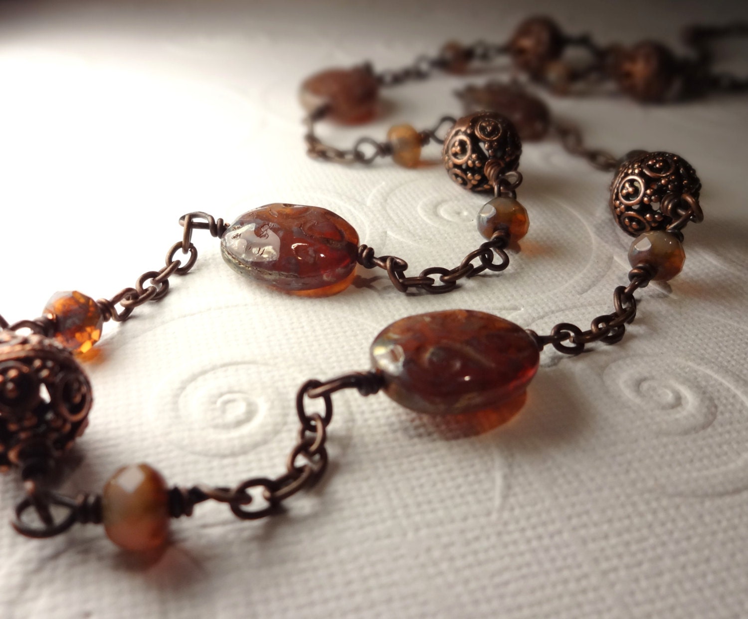 Long Carved Amber Picasso Czech Glass and Antique Copper Necklace
