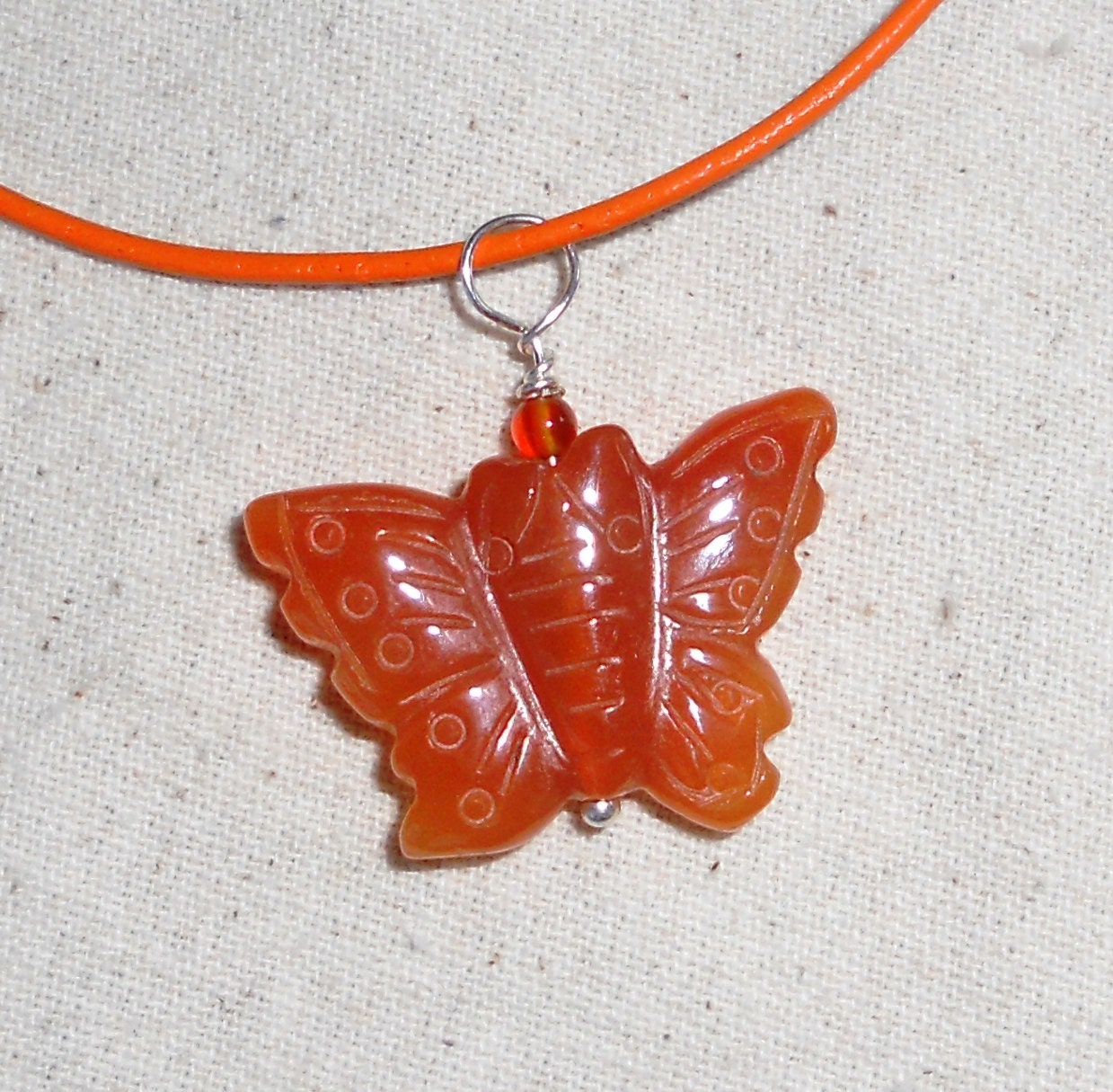 Orange carnelian butterfly pendant on an orange leather cord necklace semiprecious stone jewelry packaged in a gift bag 924A