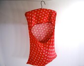 Mid century vintage red clothespin bag holds 92 old wooden clothespins for outdoor spring fresh laundry dried on the line.