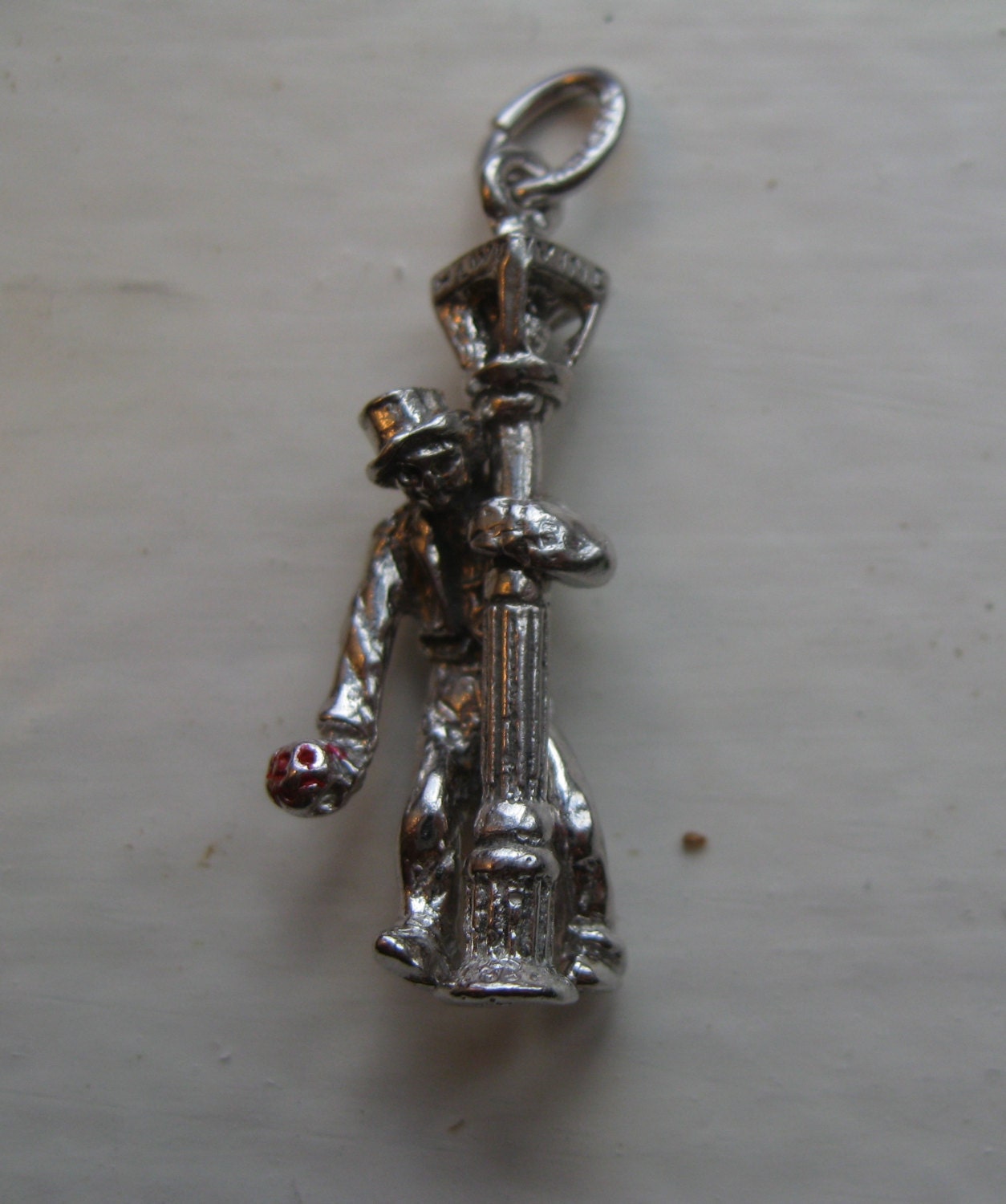 sterling silver movable man on lampost charm, swings around, Gene kelly style vintage charm