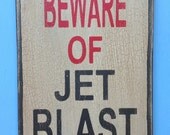 Beware of jet blast sign made from reclaimed plywood